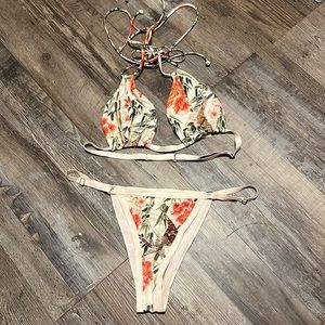 Blush pink and floral bikini size Medium. Could fit a small. Never worn